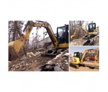 Планировка земли мини-экскаватором Caterpillar 305